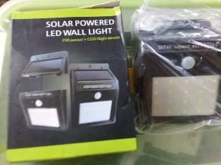 SOLAR POWERED LED WALL LIGHT WITH SENSOR FOR KENNEL USAGE photo